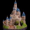 "The Castle of the Merry Ghost" fantasy sculpture by Gary Kinsella, featuring a magical castle with blue roofs and 24k gold-plated spires. Hand-painted collectible by Windstone Editions.