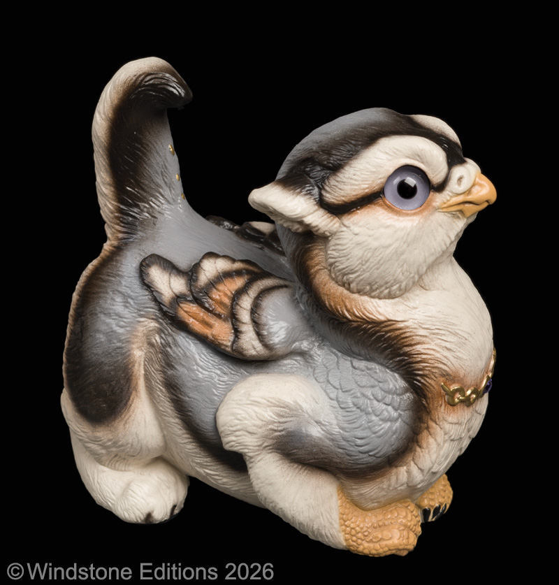 Crouching Griffin Chick fantasy figurine. Hand-painted collectable sculpture by Windstone Editions painted in a silver wolf pattern.