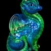 Fledgling Dragon fantasy figurine in Emerald Peacock with blue glass eyes and an amethyst-colored jewel. Hand-painted collectible sculpture by Windstone Editions.