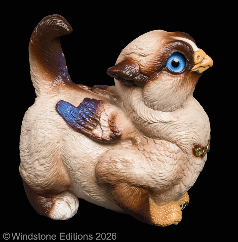 Crouching Griffin Chick fantasy figurine. Hand-painted collectable sculpture by Windstone Editions painted like a Siamese cat with white paws.