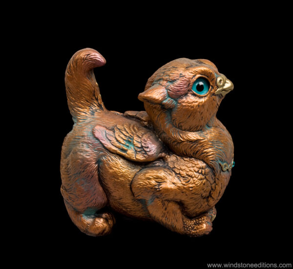 Crouching Griffin Chick fantasy figurine in Copper Patina with teal eyes and blue zircon-colored jewel. Hand-painted collectible by Windstone Editions.