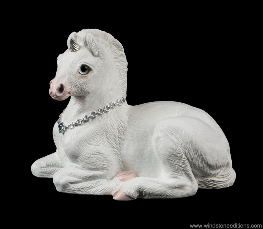 Baby Unicorn fantasy figurine in snow white with silver colored details. Hand-painted collectible sculpture by Windstone Editions