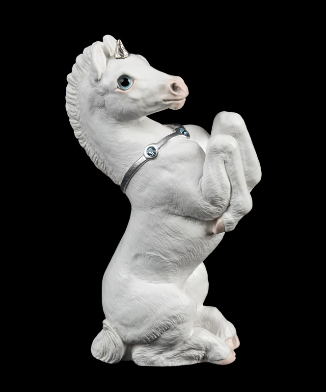 Unicorn Colt fantasy figurine in snow white with silver colored trim. Hand-painted collectible sculpture by Windstone Editions