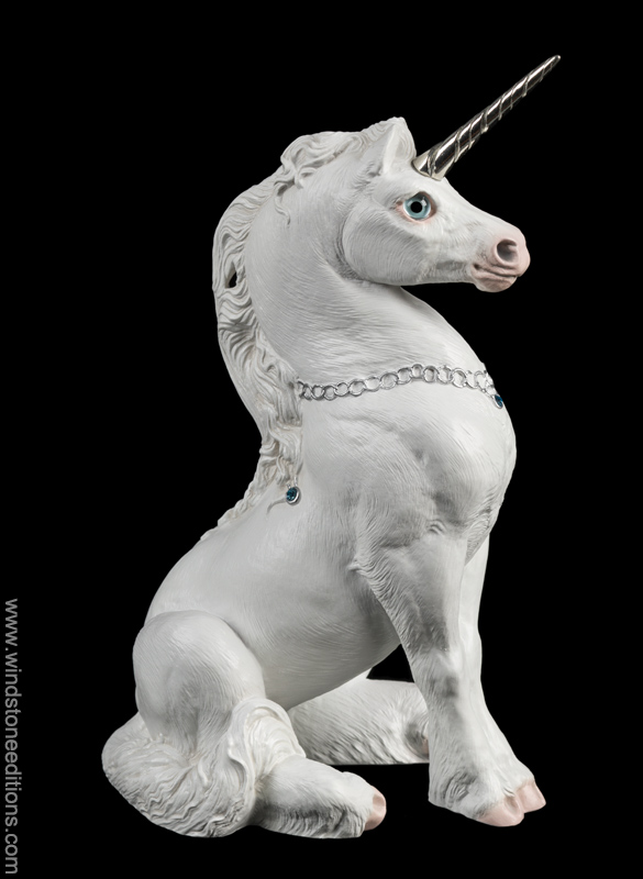 Young Unicorn in snow white with silver colored details. Hand-painted collectible sculpture by Windstone Editions