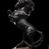 Grand Unicorn fantasy figurine painted in jet black with silver detail. Hand-painted collectable sculpture by Windstone Editions