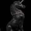 Young Unicorn fantasy figurine in black with silver painted details. Hand-painted collectable sculpture by Windstone Editions