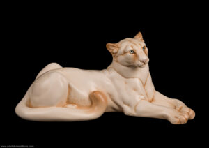 Cougar figurine. Hand-painted in ivory color with blue eyes. Collectable sculpture by Windstone Editions