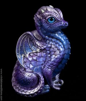 Fledgling Dragon fantasy figurine in lavender, blue, and pearl with silver details, metallic blue eyes, and tanzanite-colored crystal. Hand-painted collectible sculpture by Windstone Editions.