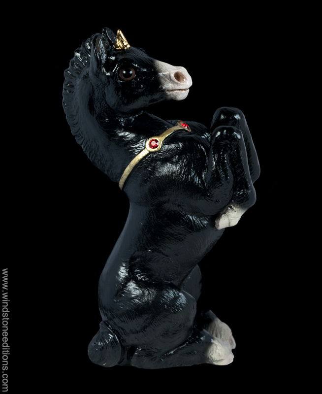 Unicorn Colt fantasy figurine in black with gold colored details. Hand-painted collectible sculpture by Windstone Editions