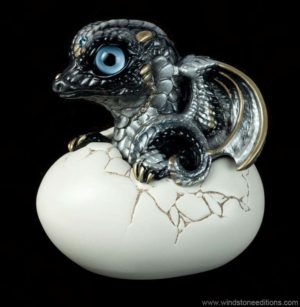 Hatching Dragon (version 2) in Silver Intense Black with pearly-silver to black shading, gold detailing, light blue glass eyes, and an aquamarine jewel. Hand-painted collectible by Windstone Editions