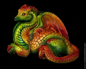 Female Hearth Dragon fantasy figurine in Citrus with dark orange eyes, gold details, and a dichroic crystal globe. Hand-painted collectible sculpture by Windstone Editions.