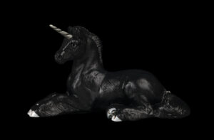 Resting Ponycorn fantasy figurine in Jet Black with silvery pewter horn, silver glass eyes, and crystal-colored jewel. Hand-painted collectible by Windstone Editions