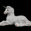 Resting Ponycorn fantasy figurine in white with silver colored detail. Hand-painted collectible sculpture by Windstone Editions