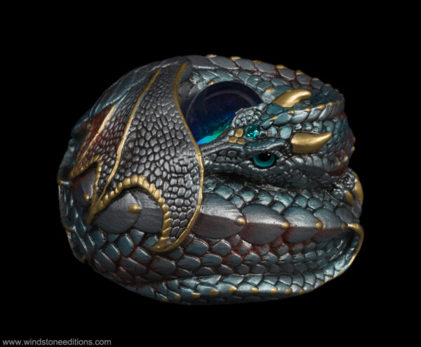 Ancient Steel Curled Dragon fantasy figurine with polished silver and blue scales, aquamarine-colored jewel, and teal glass eye. Hand-painted collectible sculpture by Windstone Editions.