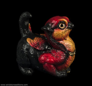 Crouching Griffin Chick figurine in fiery red and orange with gold chain and topaz jewel by Windstone Editions. Hand-painted fantasy collectible for indoor display.