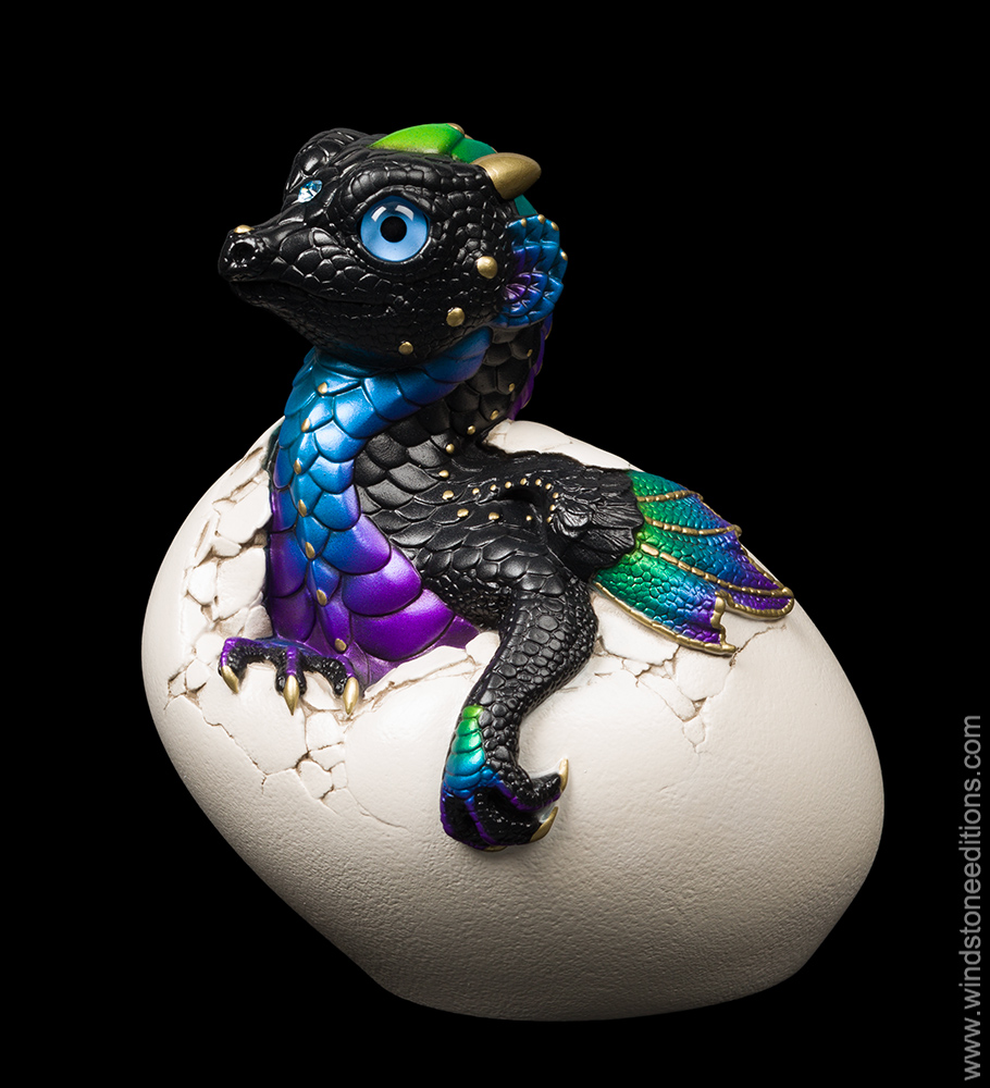 Hatching Empress Dragon fantasy figurine. Hand-painted collectable sculpture by Windstone Editions in shades of black, violet, and peacock blue